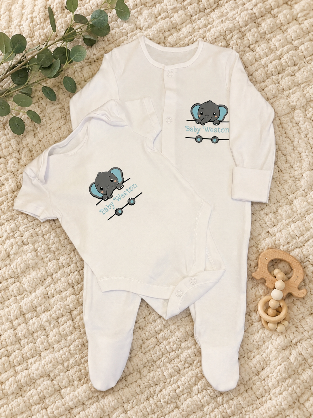 Personalised elephant newborn baby set with matching sleepsuit and bodysuit showing Baby Weston name