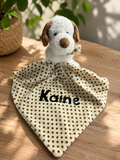 Personalised baby comforter with soft puppy head and cream polka dot blanket personalised with the name Kaine